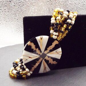 BLACK, GOLD & WHITE GLASS SEED BEAD MULTISTRAND W/ INLAY MEDALLION BRACELET 57